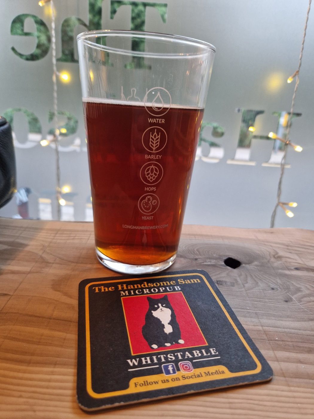 A pint of red ale on a Handsome Sam beer mat